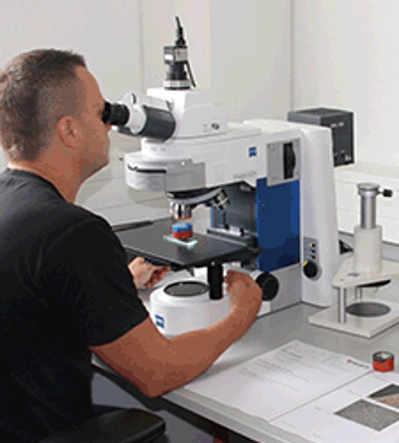 Male Employee Using Rockwell Hardness Tester